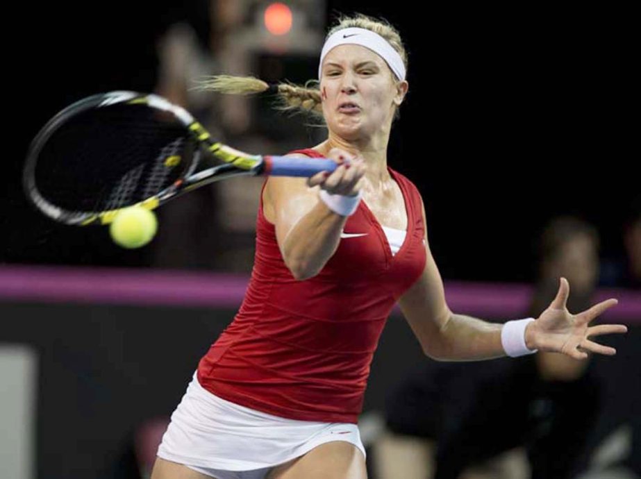 Eugenie Bouchard of Canada returns a shot to Kristina Kucova of Slovakia during the second match at the Fed Cup tennis tournament at Laval University in Quebec City on Saturday.