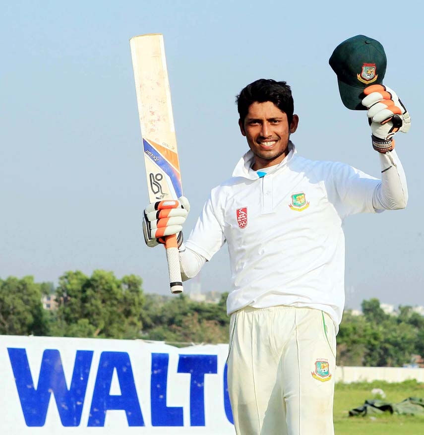 Anamul Haque of Khulna Division celebrates his century against Dhaka Division on the third day of their four-dayer match of the Walton 15th National Cricket League at Sheikh Kamal International Cricket Stadium in Cox's Bazar on Monday.