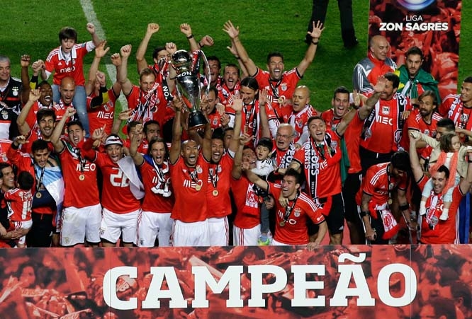Benfica players celebrate with the trophy at the end of their Portuguese league soccer match with Olhanense on Sunday at Benfica's Luz stadium in Lisbon. Benfica defeated Olhanense 2-0 to win the championship with two rounds left to play.