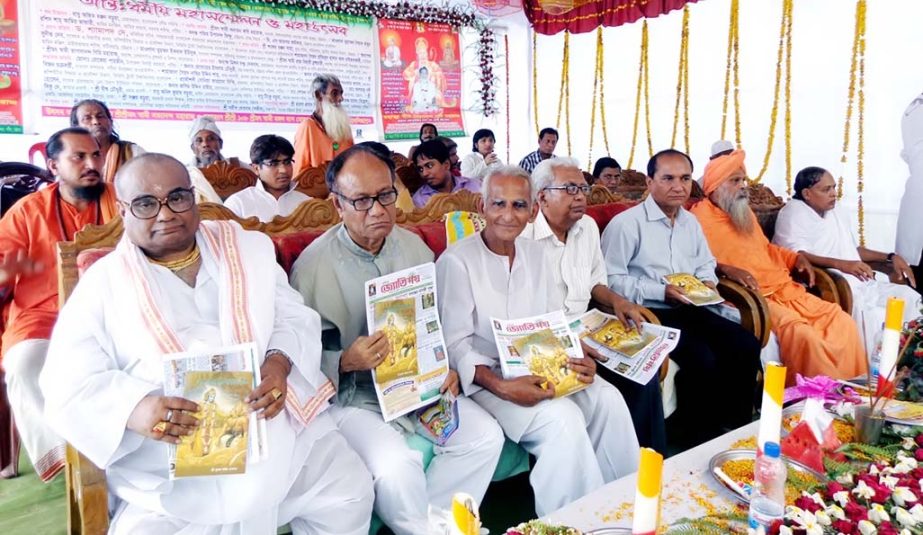 Additional Secretary to the Government of Bangladesh Dr Shamaprashad Dey unwrapping the cover of Jortimoy Publication at an inter-religious conference at Patiya yesterday.