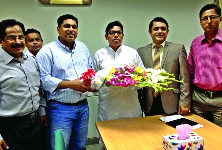 A Bangladesh-Malaysia Chamber of Commerce and Industries team led by its Secretary General Raquib Mohammad Fakhrul presenting bouquet to State Minister for Post and Telecommunication, Zunaid Ahmed Palak at the latter's office on Tuesday.