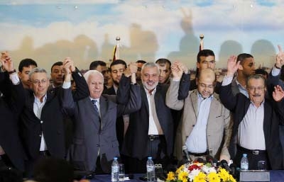 From left: Palestinian legislator Mustafa Barghouti, Palestinian Fatah delegation chief Azzam al-Ahmed, Hamas prime minister in the Gaza Strip Ismail Haniyeh, Hamas deputy leader Musa Abu Marzuk, and secretary-general of the Palestinian Arab Front Jameel