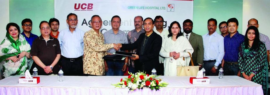 Additional Managing Director of United Commercial Bank Limited M Shahidul Islam and Managing Director of Green Life Hospital Ltd Dr Md Mainul Ahsan sign a corporate agreement for UCB employees and their family members to get medical service from Green Lif