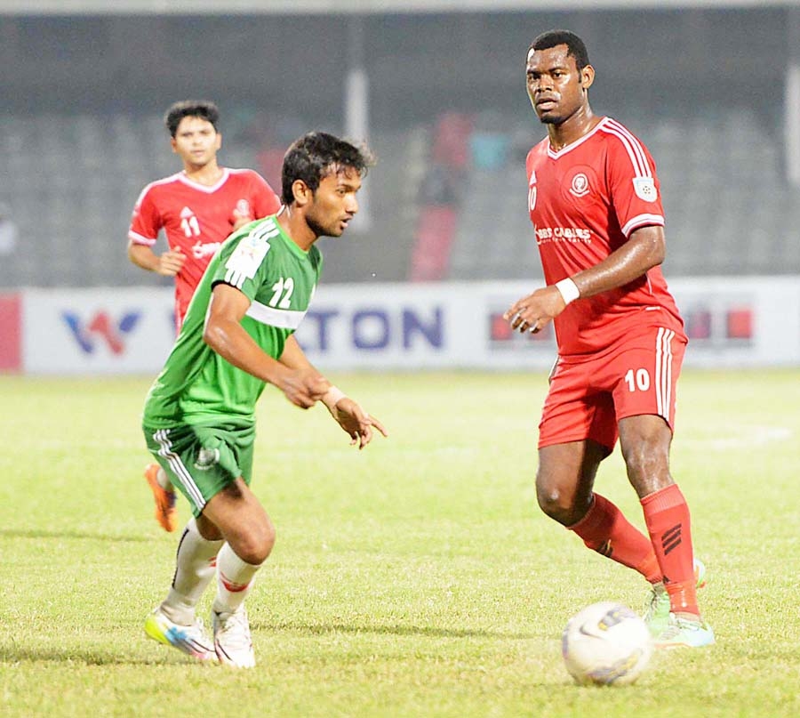 An action from the match of the Nitol Tata Bangladesh Premier Football League between Muktijoddha Sangsad Krira Chakra and Team BJMC at the Bangabandhu National Stadium on Thursday. Muktijoddha won the match 4-2.