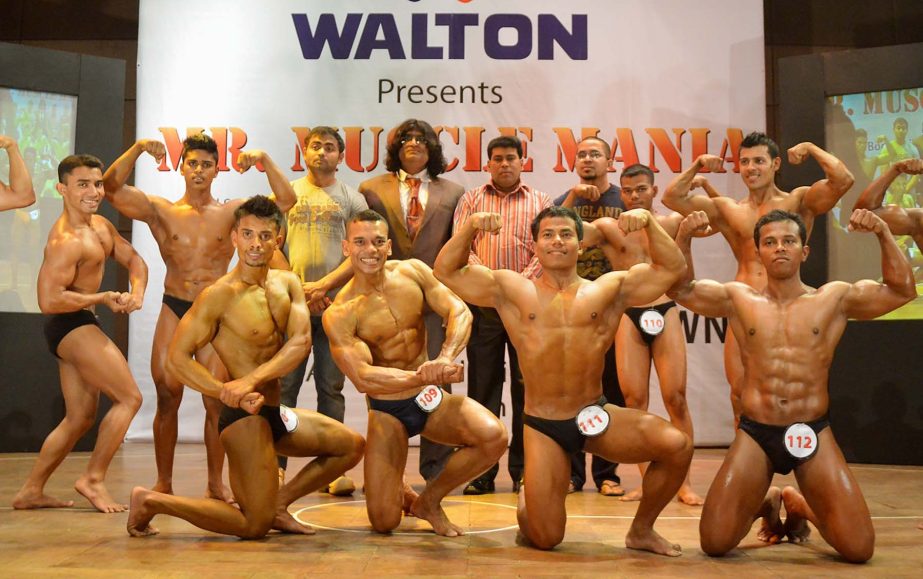 The participants of the Walton 3rd Muscle Mania Bodybuilding Competition with Additional Director of Walton FM Iqbal Bin Anwar Don and the officials of Bangladesh Bodybuilding Federation and the officials of Muscle Mania Club pose for a photo session at t