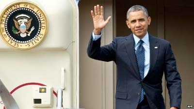 US President Barack Obama waives after landing in Malaysia.