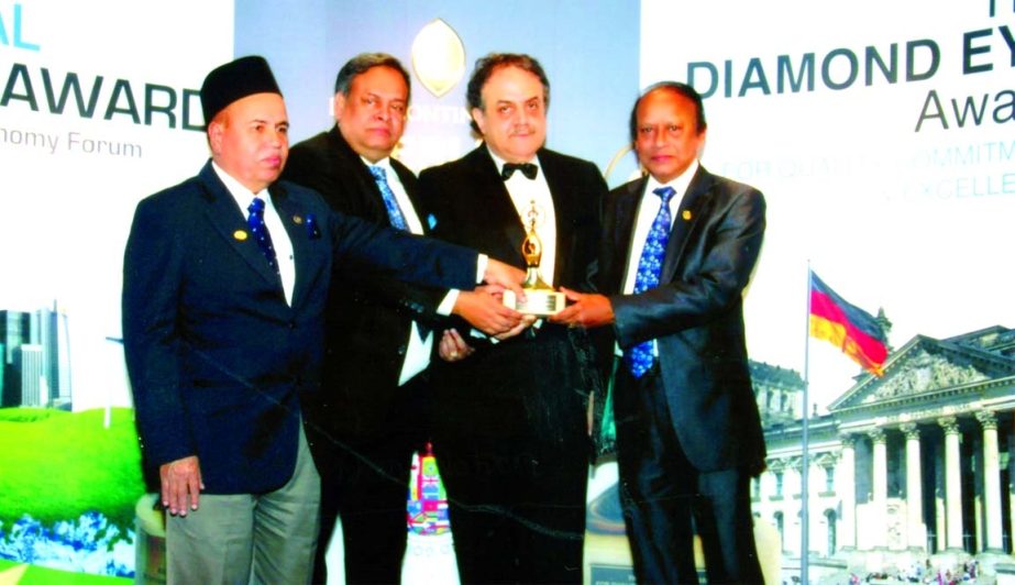 SM Abu Mohsin, Chairman, Mohd Jahangir Hossain, Vice Chairman and Md Hashmat Ali, Managing Director of Continental Insurance Limited receiving the Diamond Eye Award for "Quality Commitment and Excellence" from Charbel S Tabet, President of Association