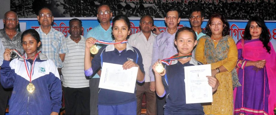 The winners of the Age Group and National Senior Gymnastics Competition and the guests pose for a photo session at the Gymnasium of National Sports Council on Saturday.