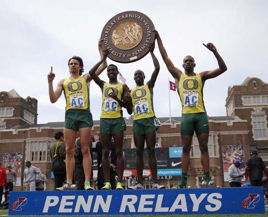 From left, Oregon's Mac Fleet Boru Guyota Edward Cheserek and Mike Berry pose for a photographs on the podium after winning the the College Men's Distance Medley Championship of America at the Penn Relays athletics meet on Friday in Philadelphia. Orego