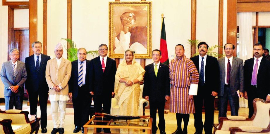 Prime Minister Sheikh Hasina pose for photograph with SAARC cabinet secretaries when they called on her at Ganobhaban in the city on Saturday. BSS photo