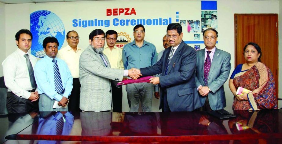 Sayed Nurul Islam, Member (Investment Promotion) of Bangladesh Export Processing Zones Authority and ARM Shahidul Haque, Director of Renaissance Barind Limited sign a deal to set up readymade garments industry in Ishwardi EPZ at BEPZA Complex in Dhaka on