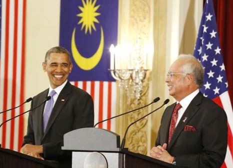 US. President Barack Obama and Malaysian Prime Minister Najib Razak both smile as they participate in a joint news conference at the Perdana Putra Building in Putrajaya, Malaysia.