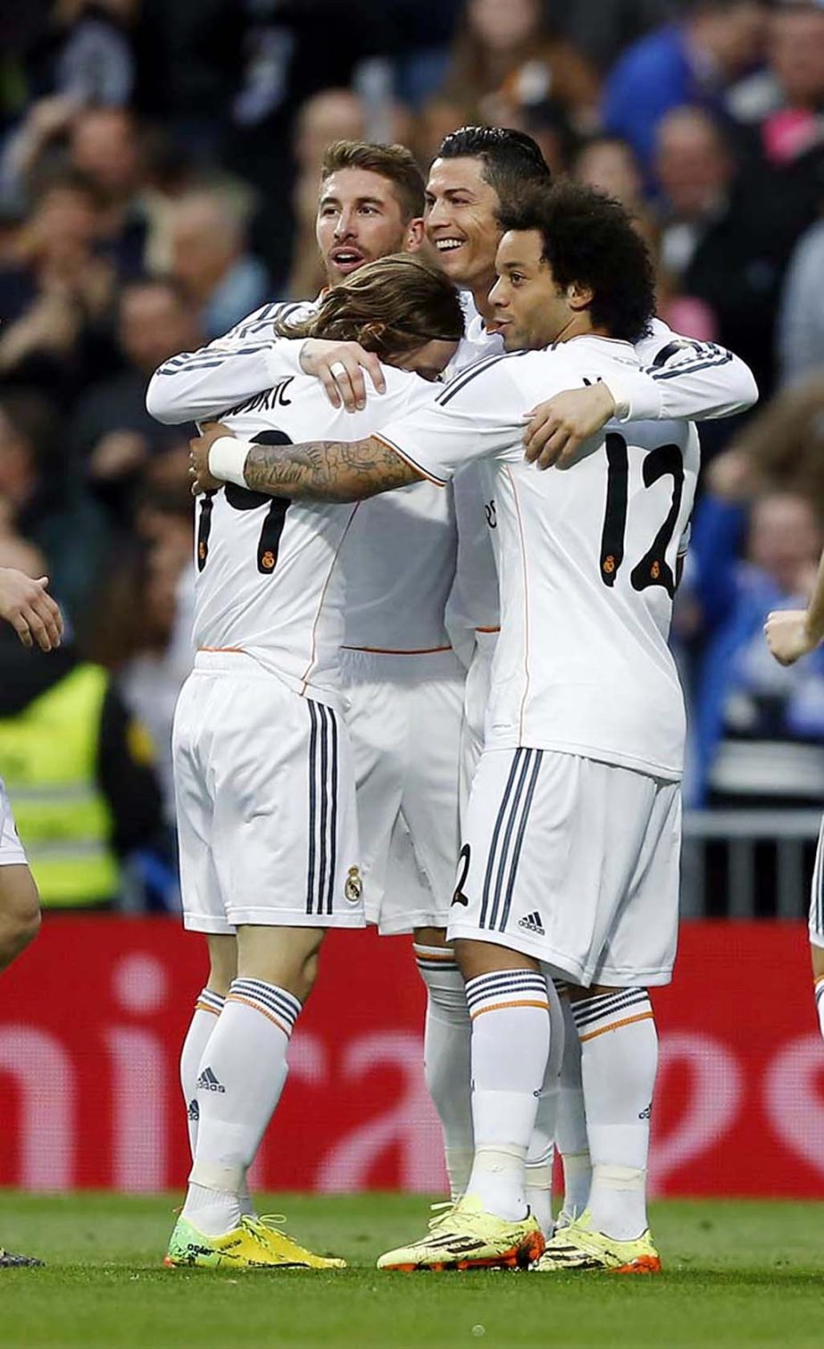 Real's Cristiano Ronaldo (center) celebrates his goal with team mates during a Spanish La Liga soccer match between Real Madrid and Osasuna at the Santiago Bernabeu stadium in Madrid, Spain on Saturday.