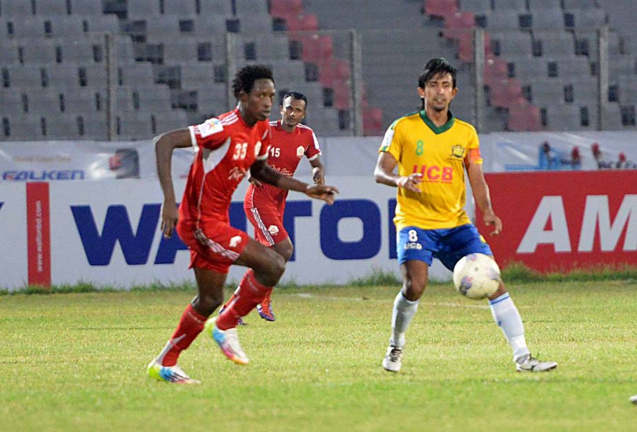 An action from the match of the Nitol Tata Bangladesh Premier Football League between Sheikh Jamal Dhanmondi Club and Soccer Club, Feni at the Bangabandhu National Stadium on Sunday. The match ended in a 2-2 draw.