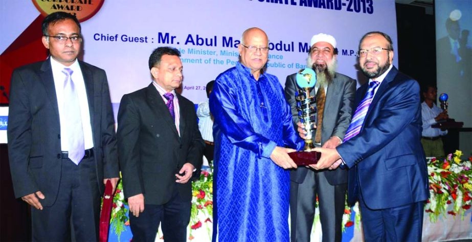 Finance Minister Abul Maal Abdul Muhith handing over "ICMAB Best Corporate AWARD-2013" by the Institute of Cost and Management Accountants of Bangladesh in Private Commercial Banks (Islamic operation) category to Muhammad Abdul Mannan, Managing Director