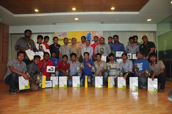 The winners of Symphony-Prothom Alo Catch the Moment Photo Contest and the officials of Symphony and the journalists of Prothom Alo pose for a photo session at the Prothom Alo Auditorium on Sunday. The photo contest started from the first day of ICC World