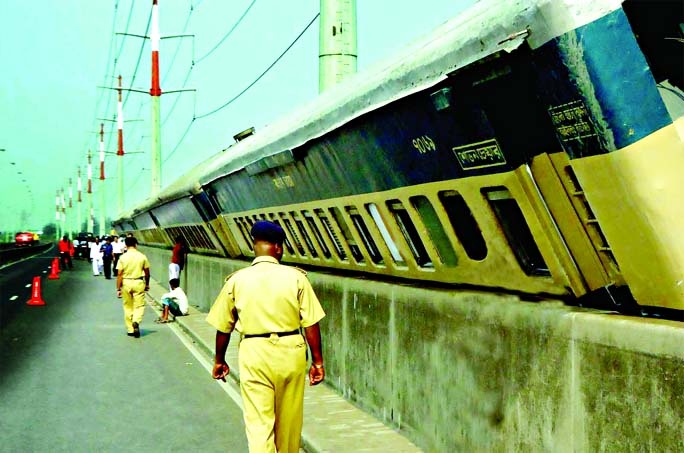 Nine compartments of Dinajpur-bound Express train derailed on Bangabandhu Bridge amid nor'wester on Sunday night.