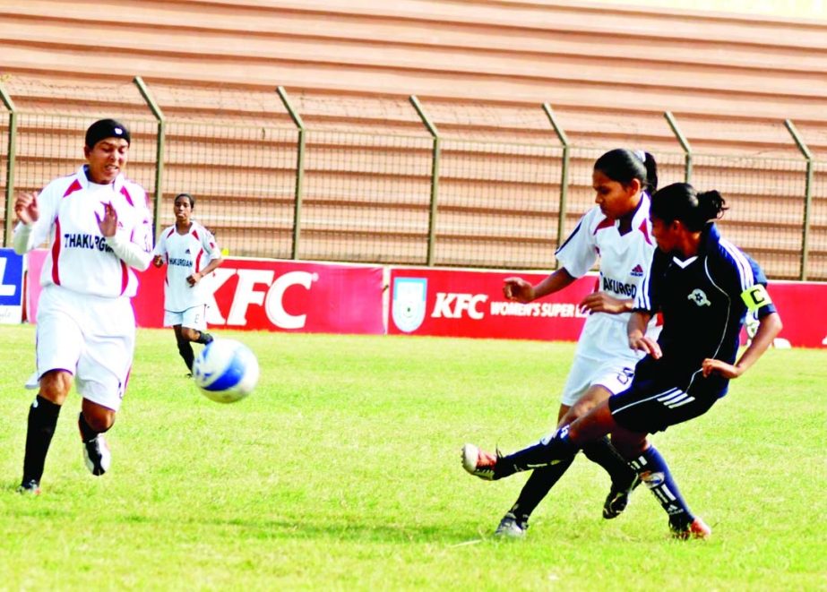 A moment of KFC National Women's Football Championships League between Rajshahi District and Naogaon District at Rajshahi District Stadium on Friday.