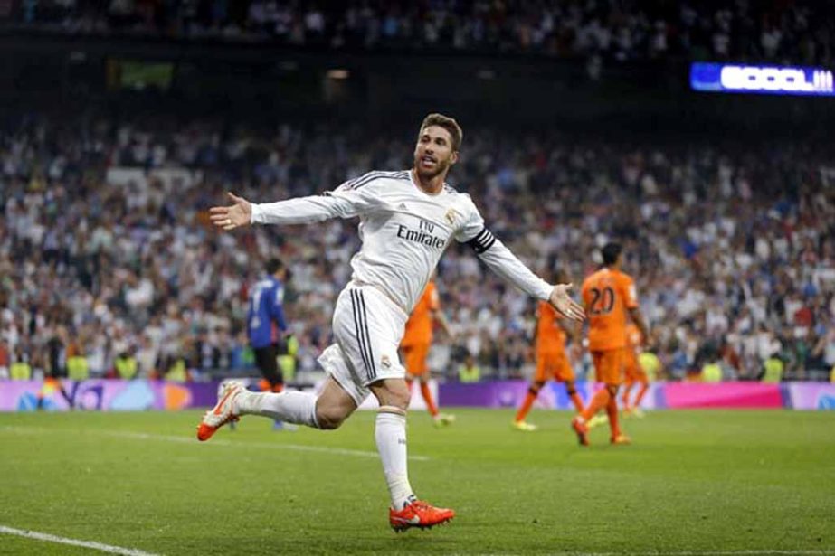 Real Madrid's Sergio Ramos celebrates his goal during a Spanish La Liga soccer match between Real Madrid and Valencia at the Santiago Bernabeu stadium in Madrid, Spain on Sunday.