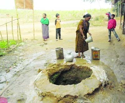 SHERPUR(Bogra): A ethnic woman collecting water from a well in Sherpur.