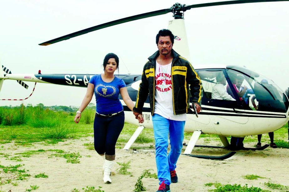 Emon and Jaanvi in a scene from movie Janena E Mon from the shooting spot in the cityâ€™s Aftab Nagar area