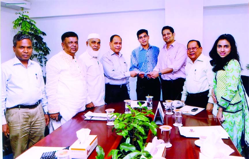 Tajul Islam, Director and Chairman of Claims Committee of Crystal Insurance Company Limited handing over a cheque of nearly Tk 9.5crore as claim to Nazir Rahim Chowdhury, Chief Operating Officer of Manami Fashion Limited recently.