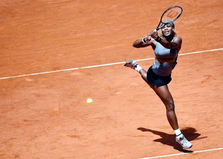 US player Serena Williams returns the ball to Spanish player Carla Suarez Navarro during their women's singles third round tennis match of the Madrid Masters on Thursday.