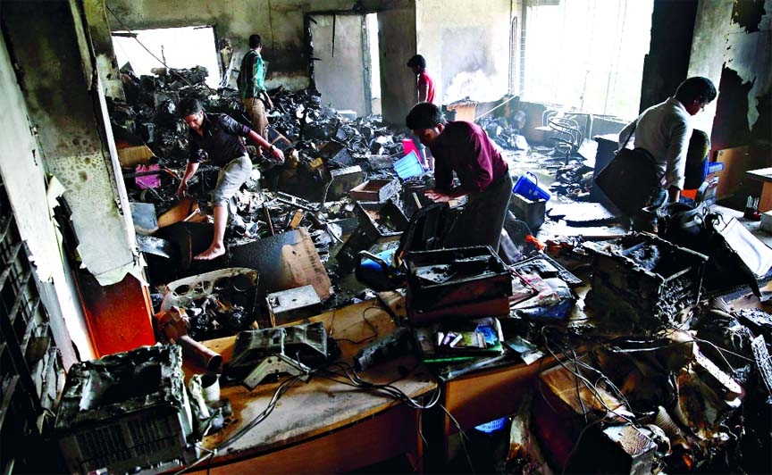 Huge number of computer sets were completely gutted when a devastating fire broke out in some shops at the fifth floor of a building in city's Elephant Road on Thursday.