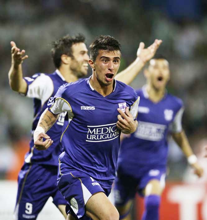 Leonardo Pais of Uruguay's Defensor Sporting celebrates scoring his team's first goal against Colombia's Atletico Nacional during a Copa Libertadores quarterfinal soccer match in Medellin, Colombia on Thursday.