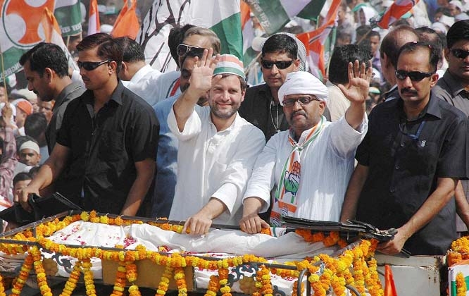 Congress Vice President Rahul Gandhi waves to the crowd at a road show with party candidate Ajay Rai in Varanasi.