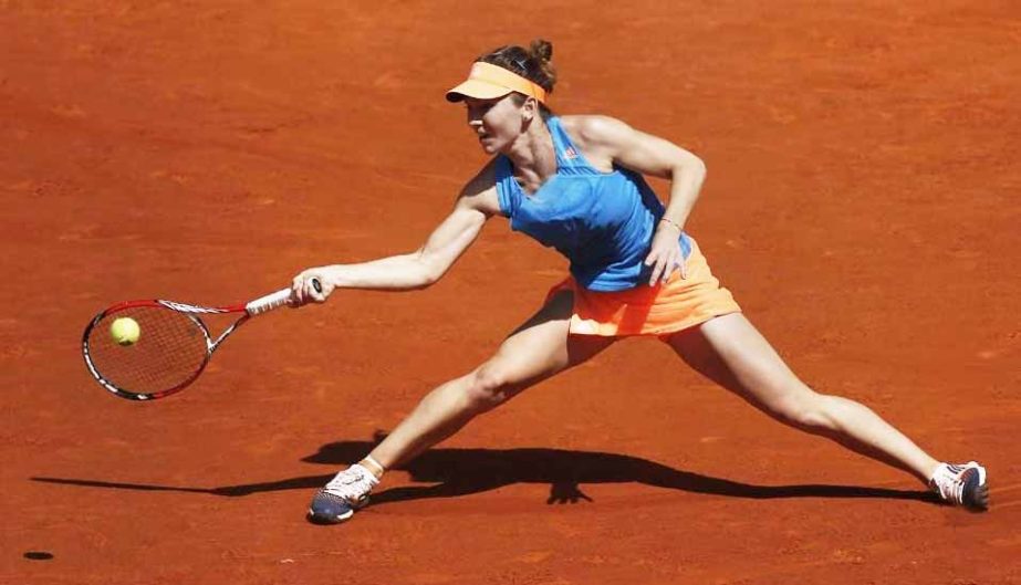 Simona Halep from Romania returns the ball during a Madrid Open tennis tournament semifinal match against Petra Kvitova from the Czech Republic in Madrid, Spain on Saturday.