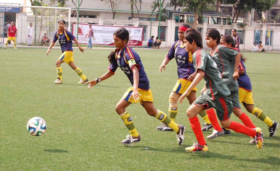 A scene from the zonal semifinal match of the KFC National Women's Football League between Narsingdi District team and Manikganj District team at the BFF Artificial Turf on Sunday. Narsingdi won the match 3-1.