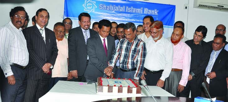 AK Azad, Chairman of the Board of Directors of Shahjalal Islami Bank Ltd inaugurating the 13th anniversary programme of the bank with Khatm-e-Quran and Doa Mahfil at its head office on Saturday.