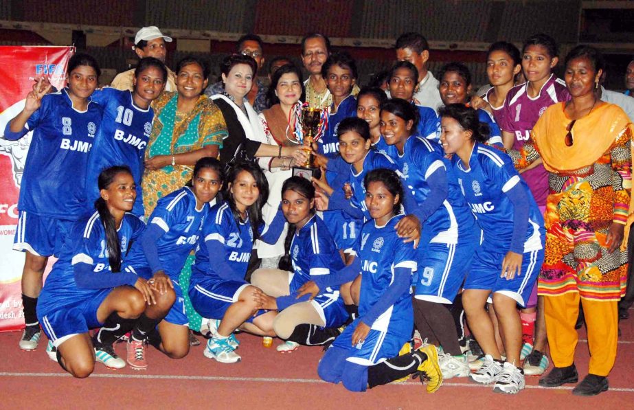 Members of Team BJMC, the champions of the Dhaka Zone of the KFC National Women's Football Tournament pose for a photo session at the Bangabandhu National Stadium on Tuesday. Team BJMC blanked Narsingdi District Women's team by 12-0 goals.