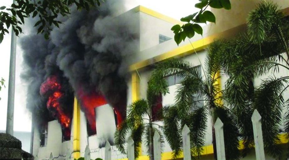Smoke and flames billow from a factory window in Binh Duong on Wednesday as anti-China protesters set several factories on fire in Vietnam, according to state media, in an escalating backlash against Beijing's deployment of an oil rig in contested waters