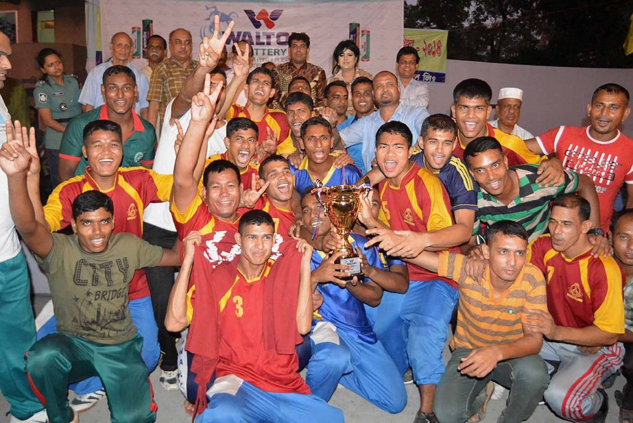 Members of BGB, the champions of the Walton Battery 31st National Senior Men's Wrestling Competition pose for a photo session at the Kabaddi Stadium on Thursday.