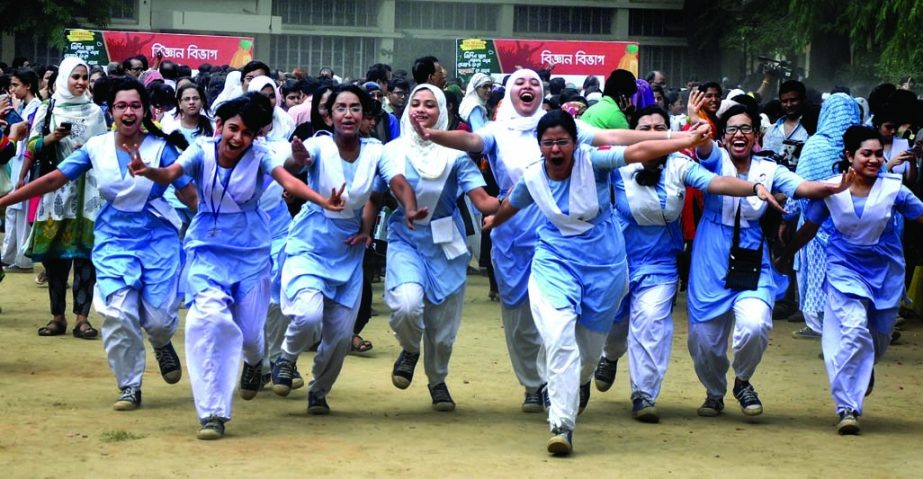 Students of Viqarunnisa Noon School exulting at the school premises in the city on Saturday as the school has secured third position in SSC Examination in Dhaka Board.