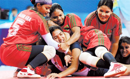 A tense moment of the first match of the Invitational International kabaddi Competition between Bangladesh National Women's Kabaddi team and West Bengal State Unit Women's Kabaddi team at the Kolkata Maidan in West Bengal of India on Saturday.