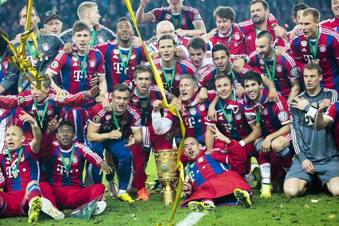 Bayern Munich players celebrate with the trophy after winning the German Soccer Cup Final between FC Bayern Munich and Borussia Dortmund at the Olympic Stadium Berlin, Germany on Saturday.