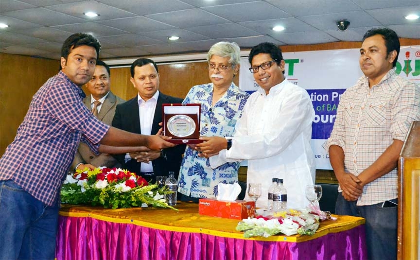 State Minister for IT, Zuniad Ahmed Palak, MP giving awards to the winners of BASIS Outsourcing Award 2014 at DIU auditorium in the city on Saturday.