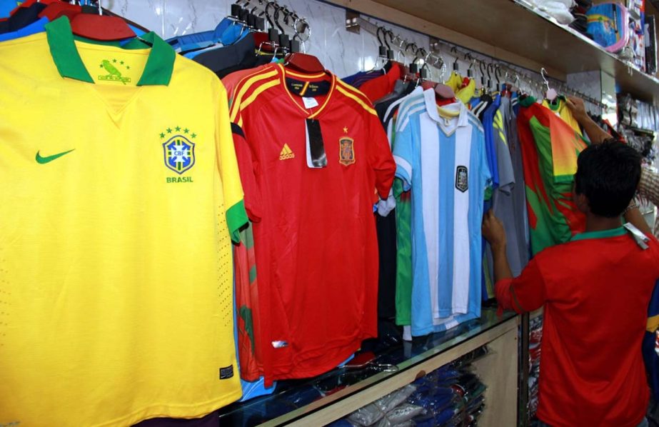FIFA World Cup Football is imminent. Though Bangladesh cannot take part in the ensuing gala extravaganza but there are millions of crazy football fans in the country. Marking the forthcoming mega football event, the shops of playing equipment are selling