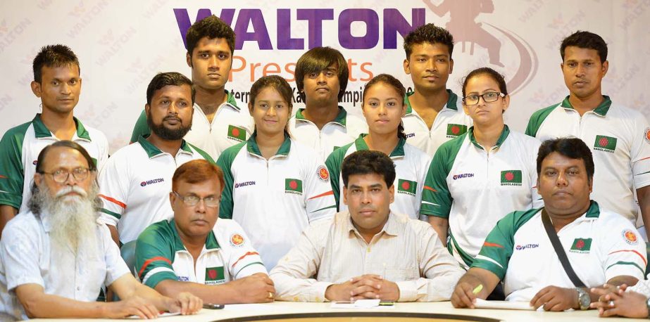 The Nepal-bound Bangladesh Karate team with the officials of Martial Art Confederation and Additional Director of Walton FM Iqbal Bin Anwar Don pose for a photo session at the conference room of Bangabandhu National Stadium on Tuesday.