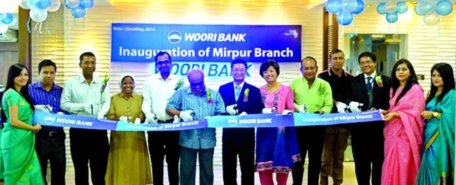 Sun Kyu Kimalong, Woori Bank's Country Manager in Bangladesh open the bank's 4th branch at Mirpur-12 in the city on Thursday.