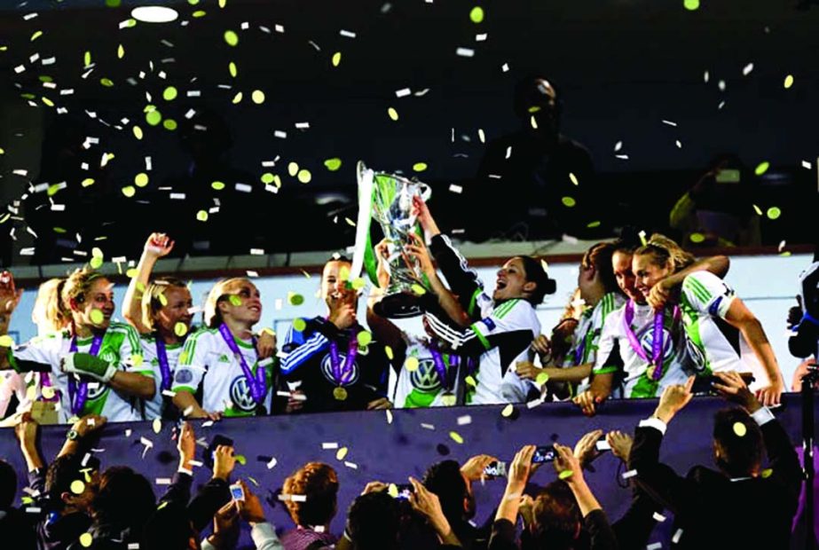 Wolfsburg's players celebrate with their trophy after winning the Women's Champions League at the Restelo stadium in Lisbon, Thursday. Wolfsburg defeated Tyreso 4-3 in the final match.