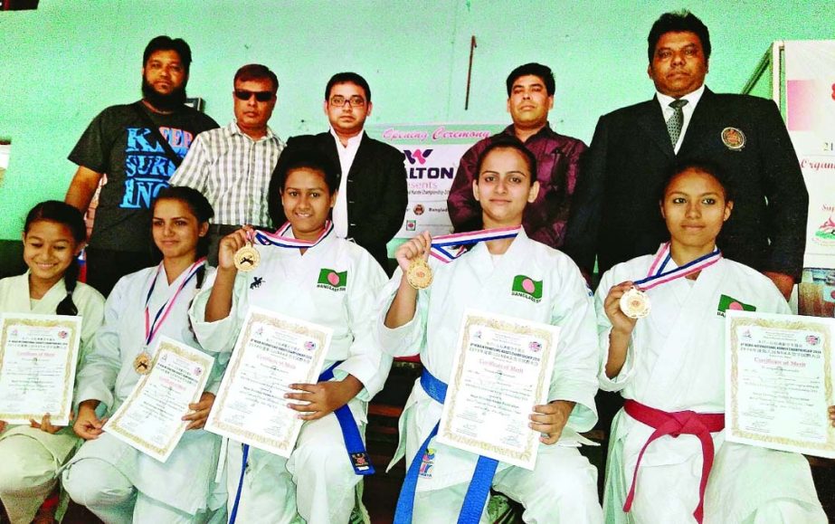 Photo shows the medal winners of the 8th NSKA International Martial Art Karate Championship with their certificates along with guests in Nepal on Friday.