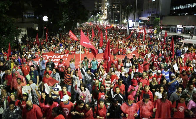 Members of the Homeless Workers Movement march during a protest against money spent on the World Cup preparations in Sao Paulo, Brazil, Thursday. The upcoming 2014 FIFA World Cup starts on 12 June.