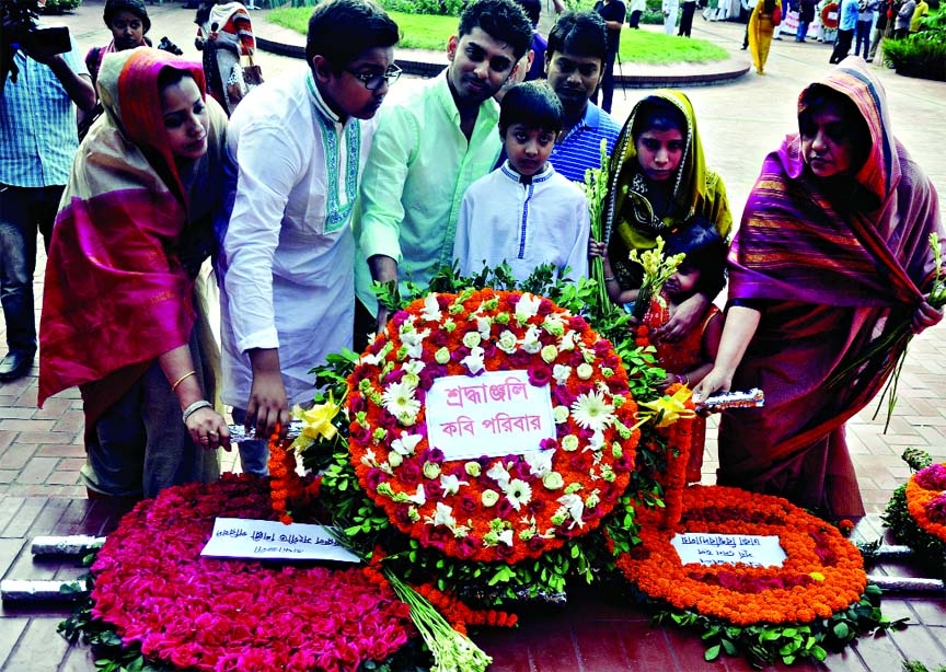 Family members of National Poet Kazi Nazrul Islam placing wreaths at the Poetâ€™s Mazar marking his 115th birth anniversary on Sunday.