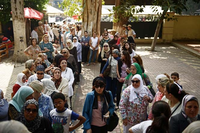 Egyptian voters wait for their turn on the first day of presidential elections in the Garden City suburb of Cairo on Monday in Cairo, Egypt.