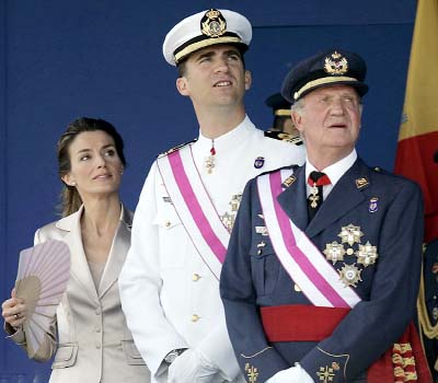 King Juan Carlos (far right) will hand the crown to his son, Prince Felipe (centre), pictured with Princess Letizia.