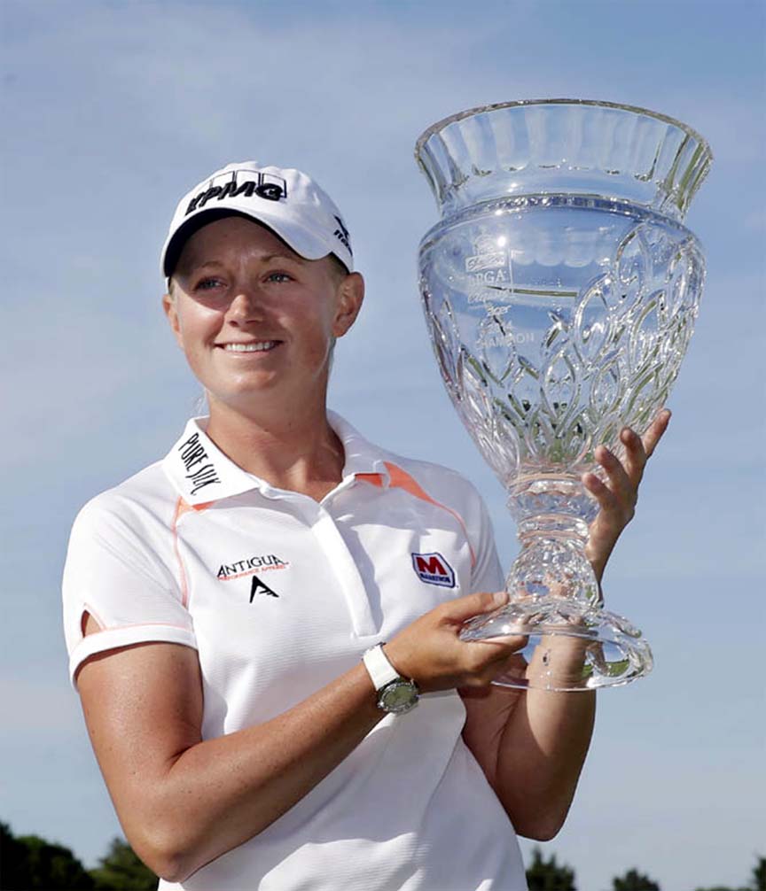 Stacy Lewis holds up the trophy after winning the ShopRite LPGA Classic golf tournament in Galloway Township, NJ on Sunday. Lewis shot 16-under-par, 197 to win the tournament.